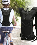 Hydration Backpack for Hiking and Trail Adventures Lightweight Water Pack with Reflective Strips showcased on bicycle rider