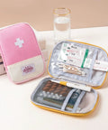 Must Have Emergency First Aid Bag Grab And Go Medical Kit with customizable compartments showing pink and yellow pouches.