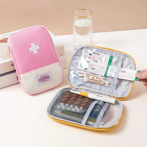 Must Have Emergency First Aid Bag Grab And Go Medical Kit with customizable compartments showing pink and yellow pouches.