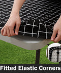 Waterproof Elastic Fitted Vinyl Table Cover 30x72 With Flannel Backing, Durable Outdoor Tablecloth, Black, being installed on a table