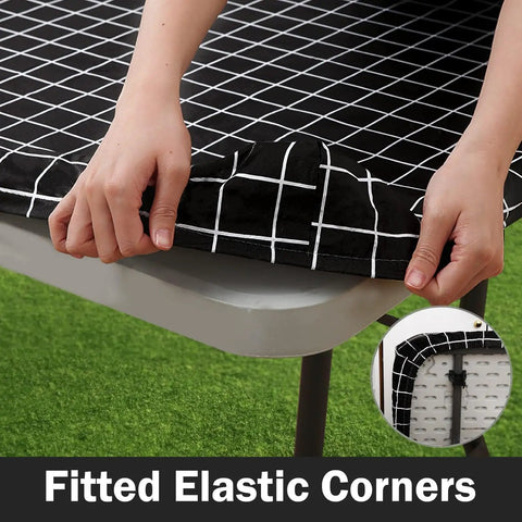 Waterproof Elastic Fitted Vinyl Table Cover 30x72 With Flannel Backing, Durable Outdoor Tablecloth, Black, being installed on a table