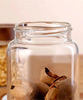Slick High Borosilicate Glass Storage Jars With Acacia Wood Lids Gonna Keep Your Kitchen Fresh These Dope Food Canisters For Coffee Sugar Nuts Are Straight Up A Nifty Counter Top Setup with nuts inside.