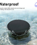 Set Of Four Matte Black Wheel Center Hub Caps Heavy Duty Abs Snap In Rim Covers Universal Fit displayed splashing in water.