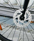 140mm 6-Bolt Stainless Steel Bike Disc Brake Rotor For Road, Mountain, BMX And Electric Scooters, attached to bicycle front wheel