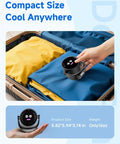 Portable Desk Fan With LED Display And 5 Speed Turbo Airflow 6 Inch Compact Table Fan being placed in a suitcase, ideal for travel.