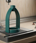Upgrade Your Woodworking With This Heavy Duty Mortising Machine Drill Press Attachment, steel support mounted on a workbench.