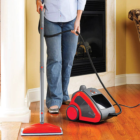 Person using red and gray steam cleaner with Washable Steam Mop Pads Replacement For Haan SI 40 SI 70 SI 35 Steamers on hardwood floor.