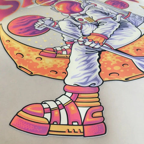 Close-up of a DTF printed image with a cartoon astronaut on colorful background, illustrating PET Film from Transfer Film Roll Bundle For DTF Printing With 23.6 Inch By 328 Foot PET Film One Pound DTF Powder And Three Thick PTFE Sheets For Hot And Cold Peel Transfers On Heat Press Or Screen Printing.