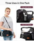 Woman using Universal Stroller Organizer With Insulated Cup Holders Detachable Phone Bag And Shoulder Strap Must Have Large Capacity Fits Uppababy Baby Jogger Britax BOB Umbrella And Pet Strollers
