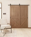 Upgrade Your Digs With This 6.6 Ft Black Sliding Barn Door Hardware Kit serving a modern wood sliding door in a stylish room.