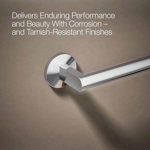 Components 24-Inch Towel Bar in Polished Chrome mounted on beige wall, showcasing corrosion and tarnish-resistant finish.