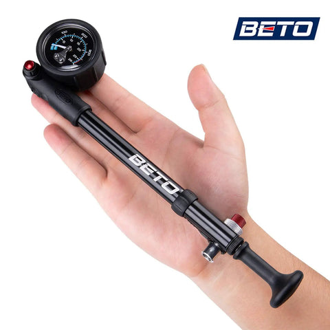 Compact high pressure MTB bike shock pump 400 PSI max for fork and rear suspension with no loss Schrader valve in hand
