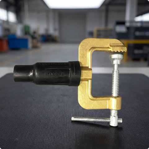 Dope Heavy Duty Grounding Clamp With Screw For Welders And Workshops Featuring Secure Insulated Handle, gold and black, with serrated jaws.