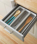 Open drawer with three compartment utensil tray for kitchen drawers with deep storage and non slip lining, holding spoons and whisk.