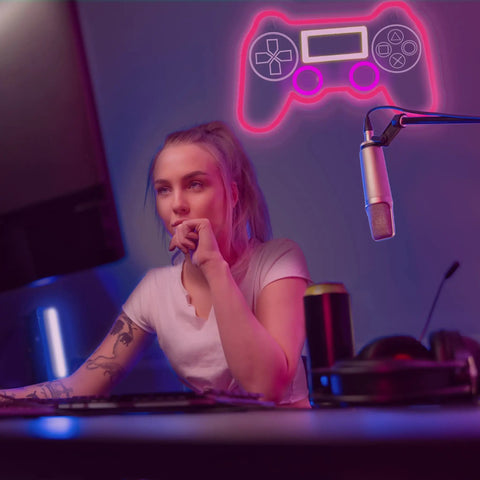 PS Controller Neon Light Sign For Gaming Rooms With Dimmer, LED Wall Decor in gaming setup with gamer under pink glow