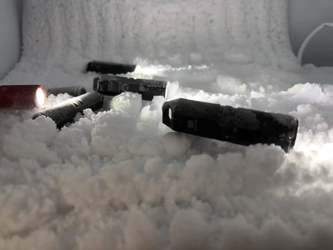 Gen 4 Mini Keychain Flashlight Ultra Bright 650 Lumens USB C Rechargeable EDC Light Water Resistant in snow demonstration