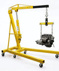 Heavy Duty 2 Ton Engine Hoist Sports Tough Lever Grip And Beefy Hydraulic Pump Delivering Knockout Cherry Picker Crane Swivel lifting an engine.