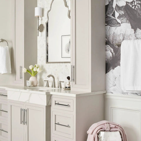 Halle Spot Resist Brushed Nickel Widespread Bathroom Faucet in elegant bathroom with floral wallpaper and modern decor.