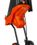 Powerful Electric Wood Chipper And Shredder With 15 Amp Motor For Easy Yard Cleanup, vibrant orange and black design on wheels