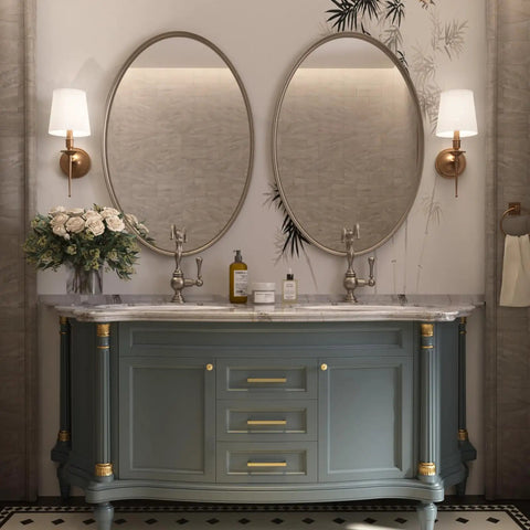 Elegant bathroom vanity with brushed brass accents and double oval mirrors, floral decor enhancing modern design.