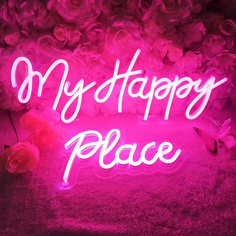 Pink LED Neon Light Sign My Happy Place Two Panel Wall Decor For Home Bar Bedroom Living Room Kid Room Wedding Gift 12V Power Adapter Included Bright Fun Glow That Feels Cozy And Cool, glowing against pink flowers.