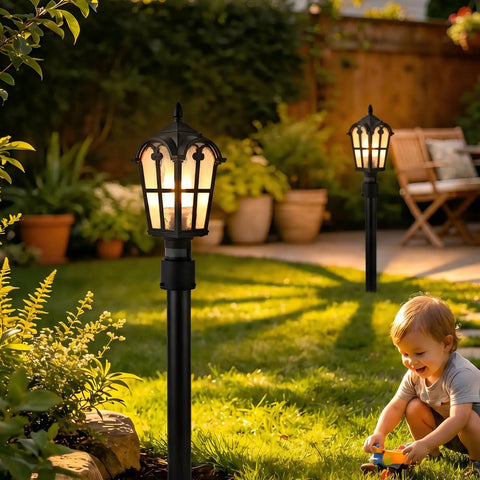 Two Pack 17 Inch Outdoor Post Light Fixtures With Motion Sensor And Dusk To Dawn, Black Pillar Lanterns lighting a garden path