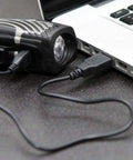 Lumina Micro 900 Front Bike Light And Vmax Plus 150 Rear Light USB Rechargeable Combo Pack being charged via laptop