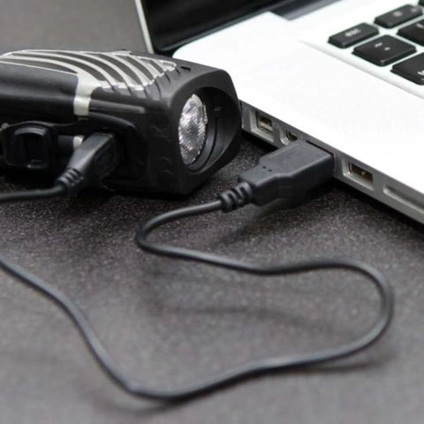 Lumina Micro 900 Front Bike Light And Vmax Plus 150 Rear Light USB Rechargeable Combo Pack being charged via laptop