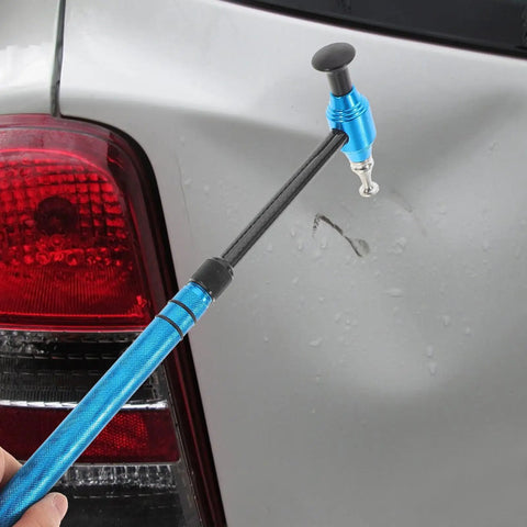 Pro Grade Multi Head Paintless Dent Removal Hammer Kit used on car door to fix dents with blue alloy tool.