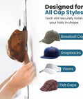 Hands placing hat on Over The Door Cap Rack Organizer 2 Pack Holds Up To 16 Hats, Adjustable Hat Hanger, showing various cap styles.