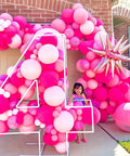 60 Piece Pink Balloons Set With 12 Inch Latex Balloons In Macaron Pink, Hot Pink, Pastel, Metallic, Matte, And Confetti Styles Plus 10m Pink And 10m Hot Pink Ribbons For Birthday Parties, Baby Showers, Weddings, And Girls Night displayed in number 4 shape outdoors