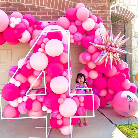 60 Piece Pink Balloons Set With 12 Inch Latex Balloons In Macaron Pink, Hot Pink, Pastel, Metallic, Matte, And Confetti Styles Plus 10m Pink And 10m Hot Pink Ribbons For Birthday Parties, Baby Showers, Weddings, And Girls Night displayed in number 4 shape outdoors