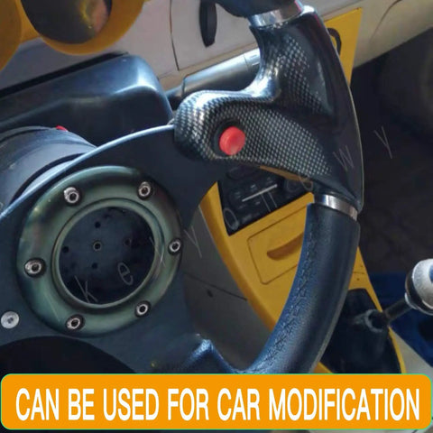 Close-up of steering wheel with carbon fiber grip and red 24Pcs 16Mm Momentary Push Button Switch for car modification.