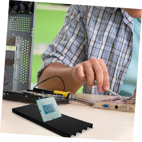 Tech professional using Antistatic Bar Rack Organizer For Circuit Boards with Grounding Tape Wrist Strap in a workshop setting.