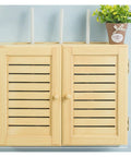 Wall Mounted Cable Organizer Box With Wooden Frame For Routers, Power Strips, And Set Top Boxes on blue wall with plant