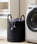 Dope Eco Friendly Tall Rope Laundry Hamper Made From Natural Cotton Rope 72L Large Laundry Basket next to washing machine