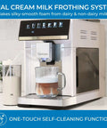Barista-Grade All In One Espresso Machine With Built In Grinder Milk Frother And Steamer Auto Tamper Descaler Color Touch Display And One Touch Drinks Like Espresso Cappuccino Latte Macchiato Americano For Home Or Office White showing front view with milk frothing system and glass cup of coffee.