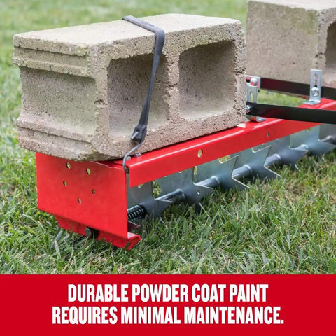36-Inch Tow-Behind Spike Aerator with 9 galvanized disks, red steel frame, weight tray with cinder blocks, on grass