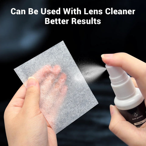 700-sheet lens cleaning tissue paper held in hand beside a spray bottle for cleaning camera and microscope lenses.