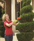Person using Cordless Shrub Trimmer And Grass Shear Combo, Lightweight Three Point Six Volt Lithium Battery, Easy Grip, Low Emission Yard Tool for pruning.