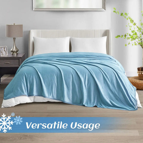 Upgraded Jade Fiber Cooling Throw Blanket With Q Max 0.5 on a bed in a cozy bedroom setting, 50x70, summer bed cover