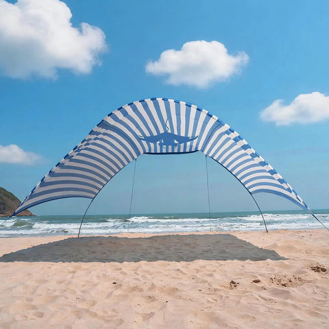 Wind-Powered Beach Shade Canopy No-Fuss Easy Setup Sun Shelter Tent With UPF 50+ UV Protection on a sandy beach