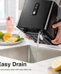 Countertop Nugget Ice Maker Cranks Out 35 Pounds Of Snap Bubble Ice Daily compactly draining water into sink.