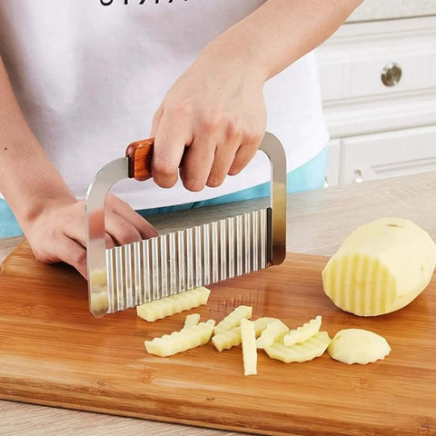 Murtenze stainless steel crinkle cutter with wooden handle, angled side view for slicing potatoes into wavy fries.