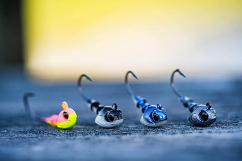 Crappie Jig Heads Multi Pack With Realistic Head Design And Sharp Hooks For Solid Hookups In One Eighth Ounce Size With Size Two Hooks With Multiple Colors Perfect For Crappie Fishing With Natural Swim Action And Versatile Performance displayed on a surface