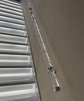 Hella Durable Acrylic Round Grab Handle With Rock Solid Metal Brackets Straight Up Secure Indoor Outdoor Wall Mount Safety Railing silver coated non slip grip on a staircase.