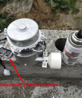 Portable 1000W 110V Water Turbine Generator on concrete block with wiring instructions and adjacent spray can