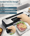 Heavy Duty Vacuum Sealer With 80Kpa Dual Pump sealing steak with lemons in kitchen, LED touch screen, and patented handle design.