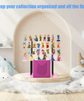 Ultimate Pink Metal Toniebox Stash Holder For 20 To 35 Tonies with organized audio figures on display rack in a room.