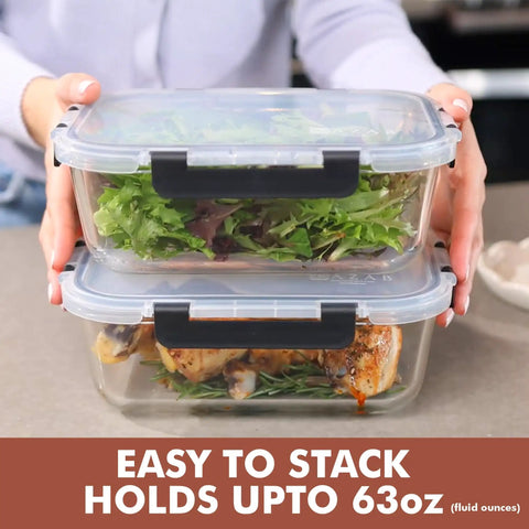 Hands holding Big Glass Storage Set 63 Oz Meal Prep Containers with Locking Lids, stacked with salad and chicken, 2-pack.